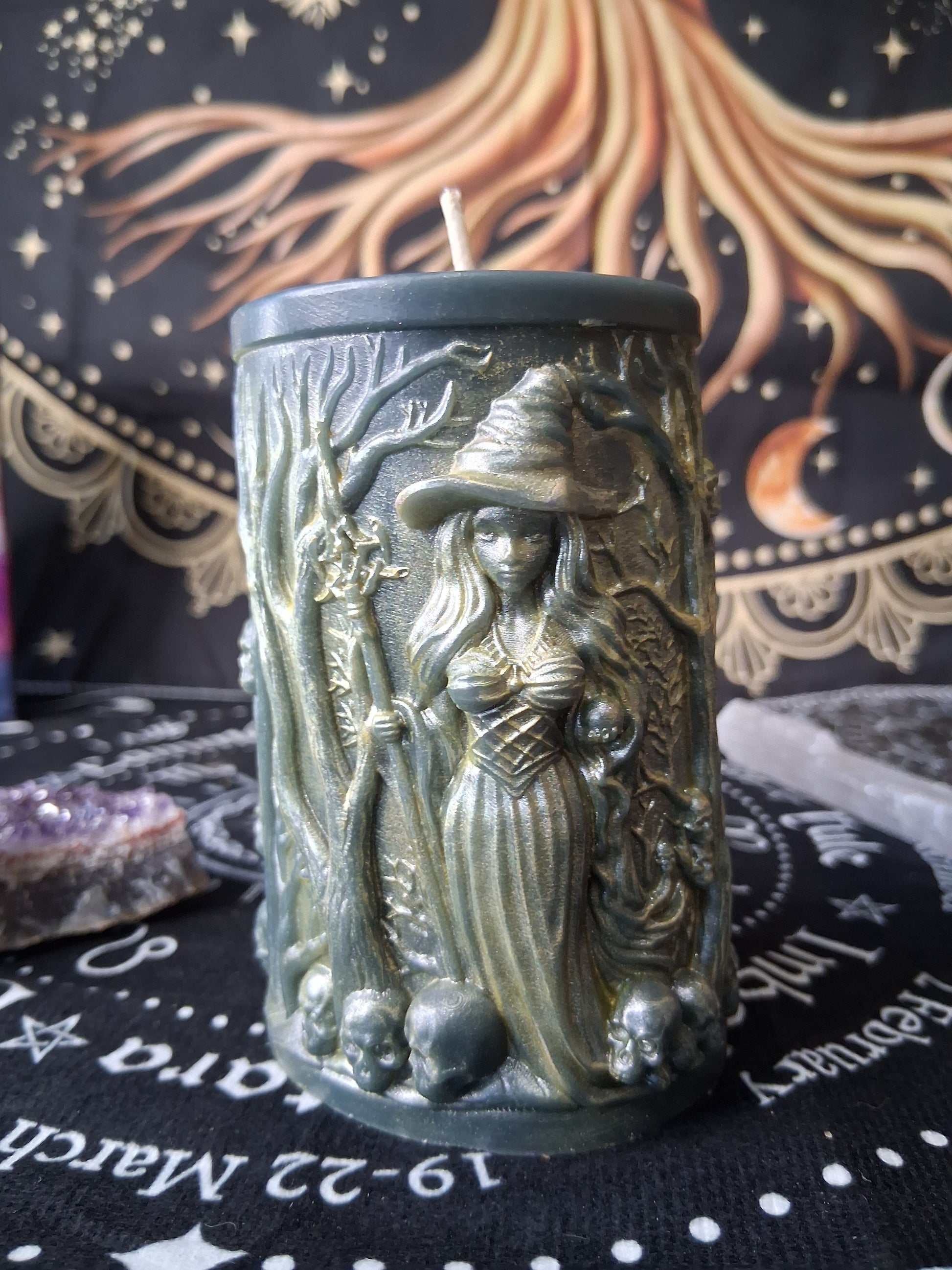 Sacred Moon Candle Co forest witch ritual candle with detailed witch and skull design in green and gold