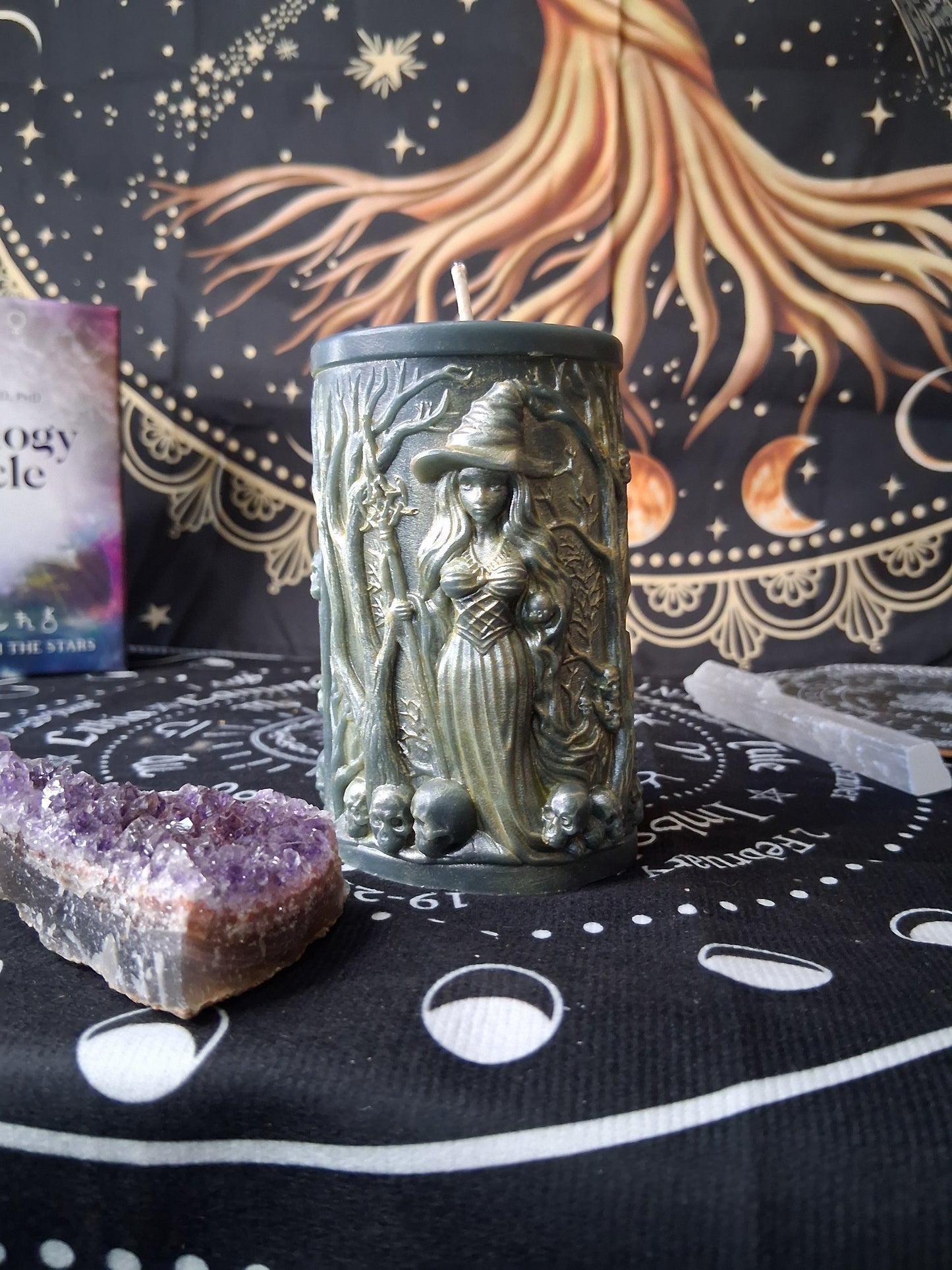 Sacred Moon Candle Co forest witch ritual candle with detailed witch design on black altar cloth