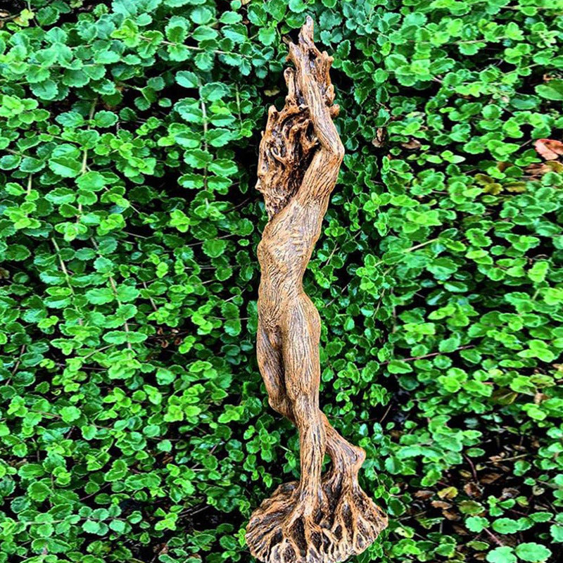 The Green Man Woman Statue Sacred Moon Candle Co tree woman sculpture with bark texture raised arms and root base on green leaves