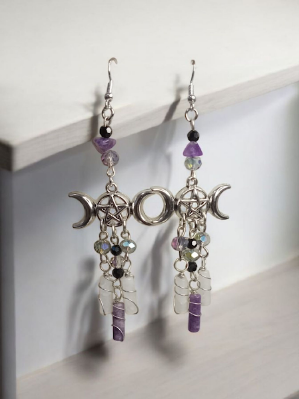 Sacred Moon Candle Co silver triple moon goddess earrings with pentacle and purple crystal beads