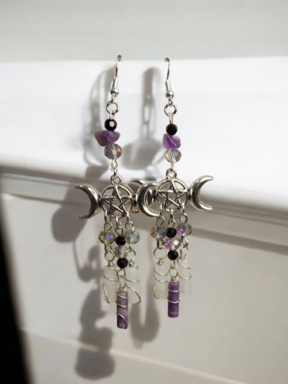 Sacred Moon Candle Co triple moon goddess earrings with pentacle charms and purple bead accents