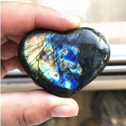 Sacred Moon Candle Co labradorite heart crystal polished heart with blue flash held in hand altar tool