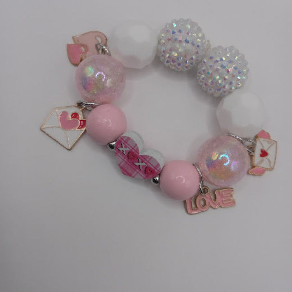 Sacred Moon Candle Co pink and white hugs and kisses heart jewelry charm bracelet