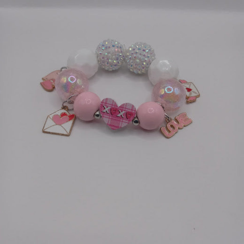 Sacred Moon Candle Co bracelet with hugs and kisses heart jewelry charm and pink white beads
