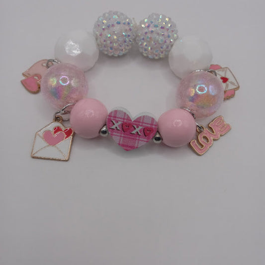 Sacred Moon Candle Co bracelet with hugs and kisses heart jewelry charm and pink white decorative beads