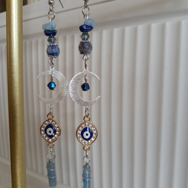 Sacred Moon Candle Co silver and blue gemstone crescent moon evil eye earrings with crystal accents