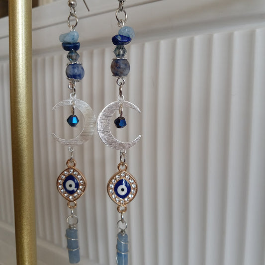 Sacred Moon Candle Co silver and blue gemstone crescent moon evil eye earrings with crystal accents