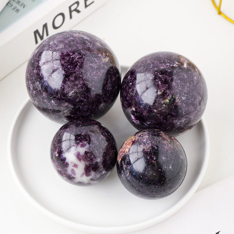 Set of four polished Purple Mica Crystal ball spheres on white dish altar tools for meditation and decor