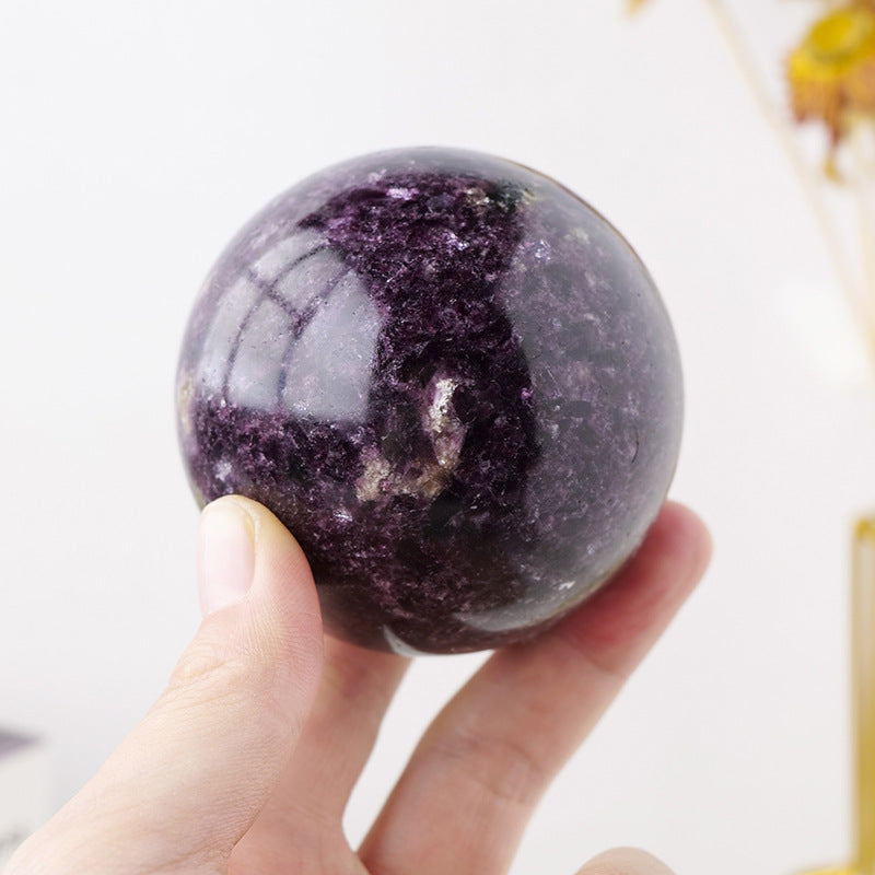 Sacred Moon Candle Co Purple Mica Crystal ball polished sphere held in hand for altar tools