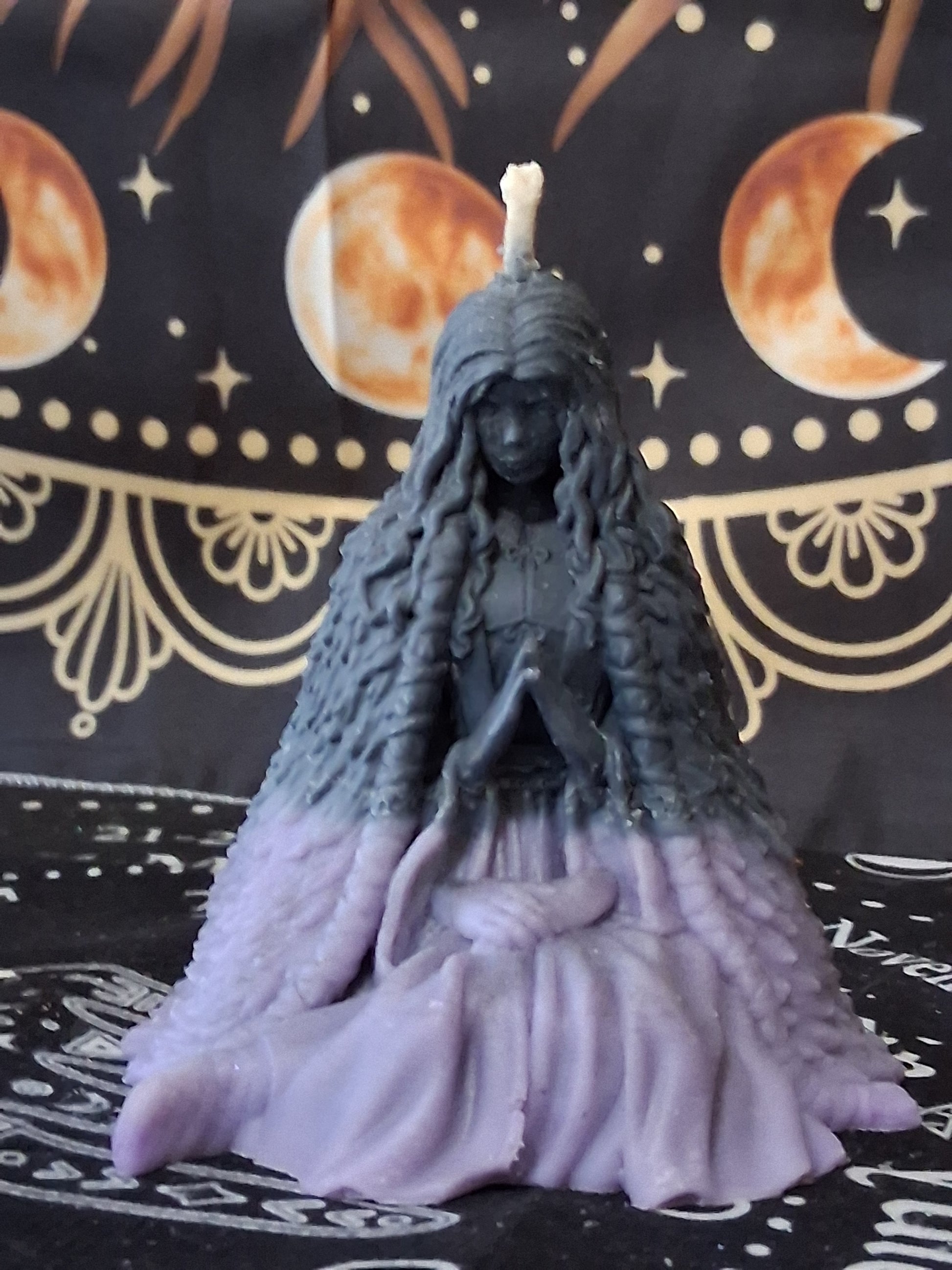 Sacred Moon Candle Co moon water bloom goddess ritual candle in purple and black with detailed figure design