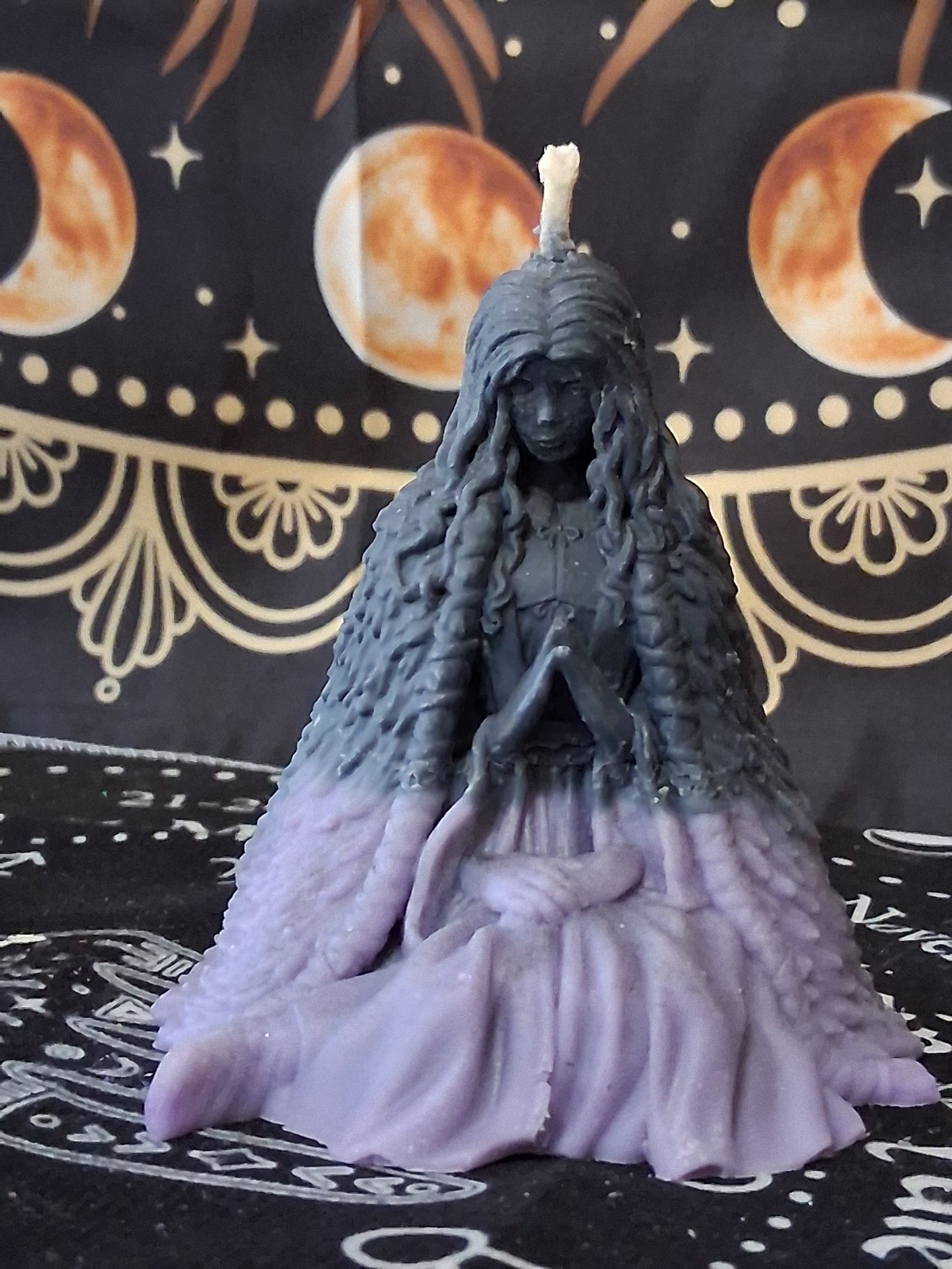Moon water bloom goddess ritual candle by Sacred Moon Candle Co in purple and black with detailed goddess figure design