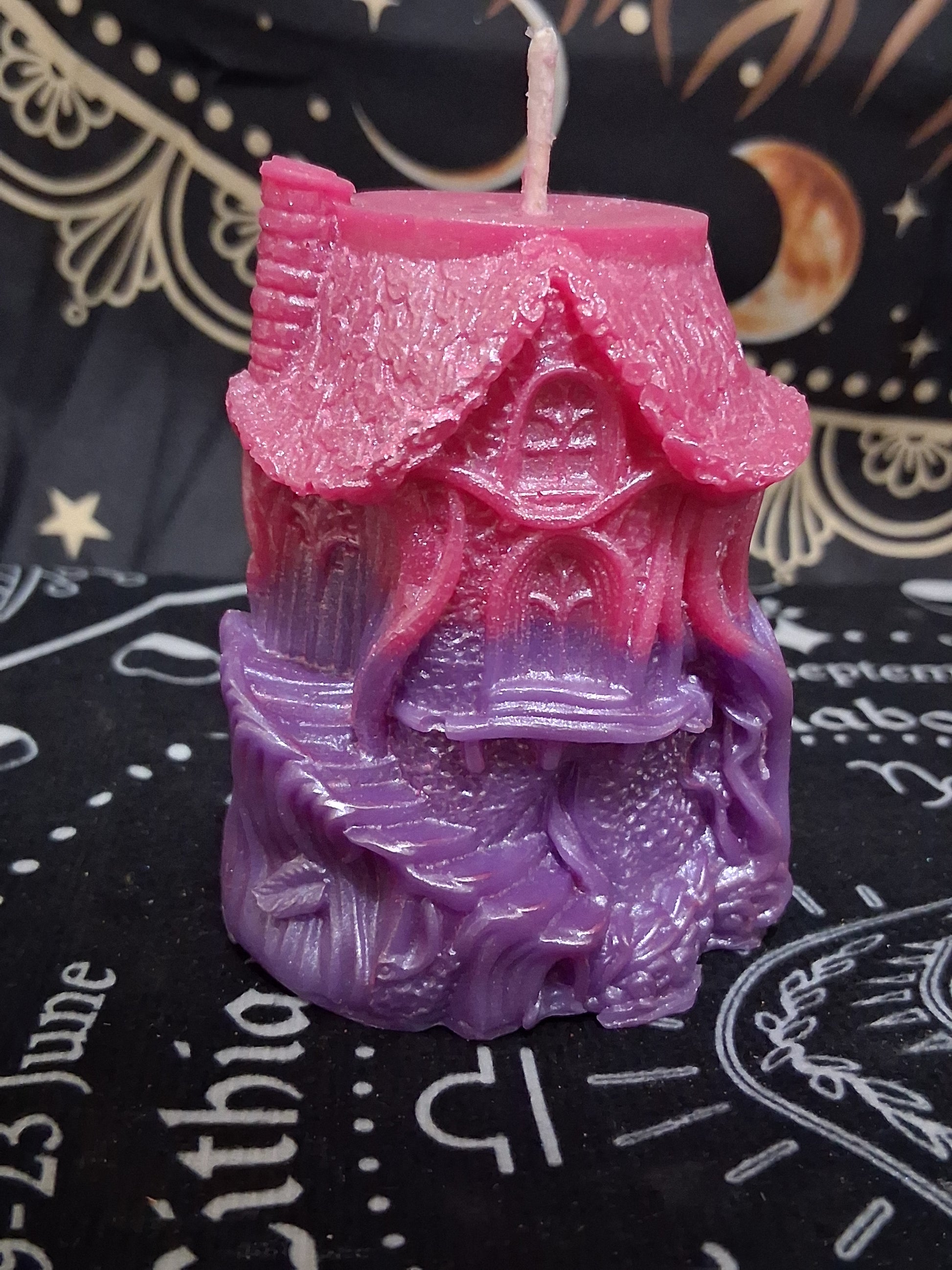 Sacred Moon Candle Co Nectar Nook Scented Treehouse Candle in pink and purple with detailed fantasy design