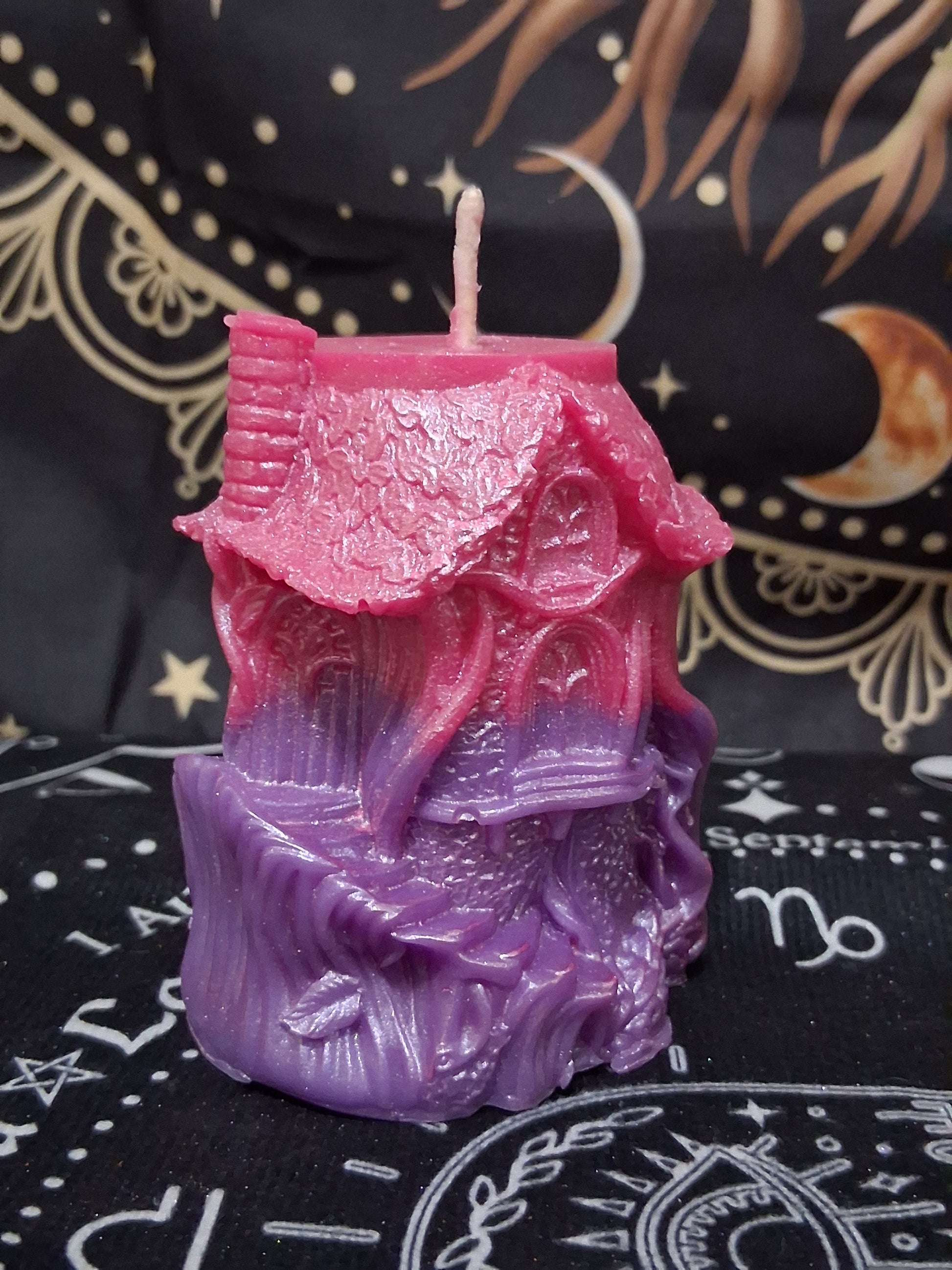 Sacred Moon Candle Co Nectar Nook Scented Treehouse Candle in pink and purple with detailed treehouse design