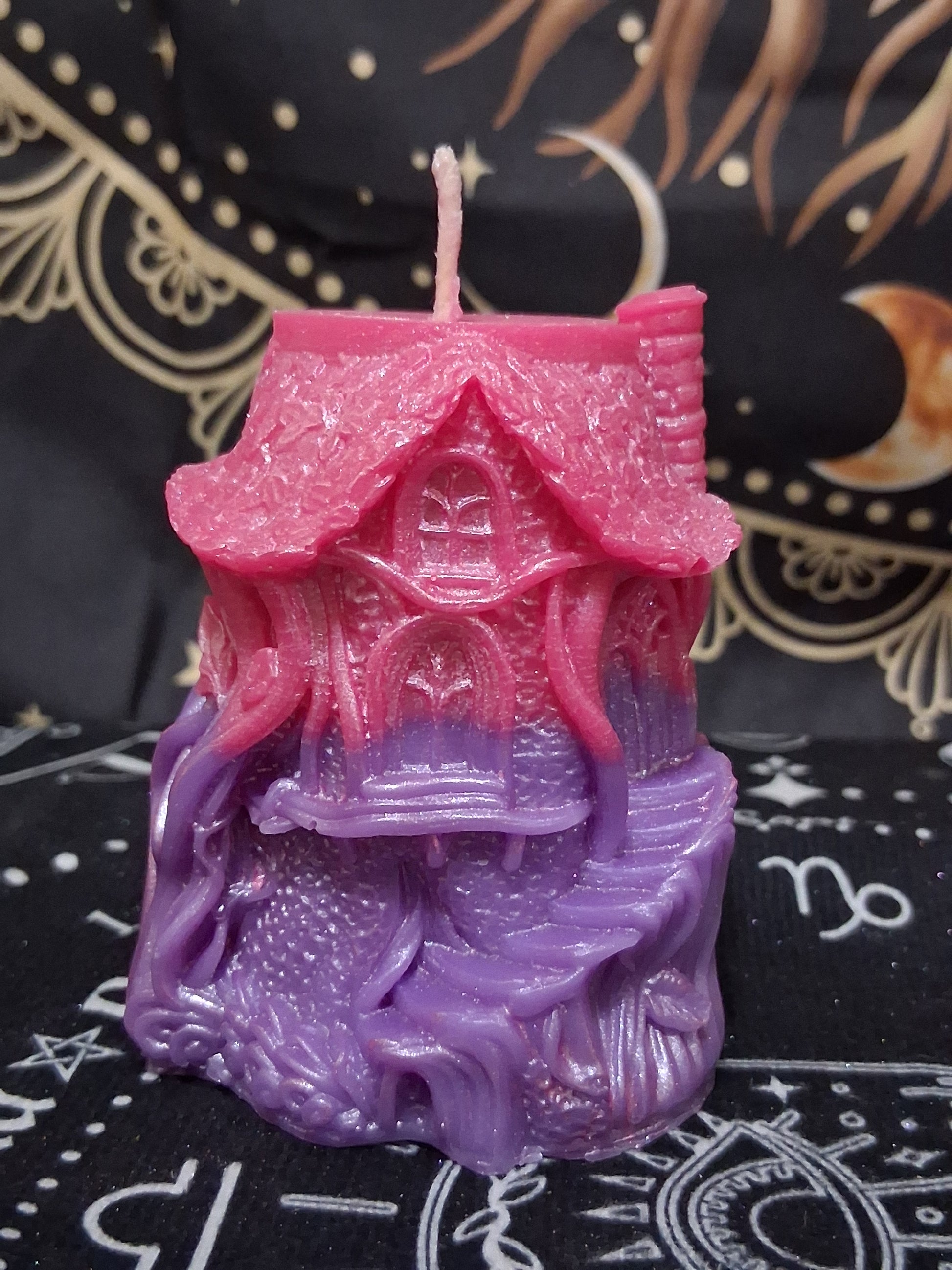 Nectar Nook Scented Treehouse Candle by Sacred Moon Candle Co in pink and purple with intricate treehouse design