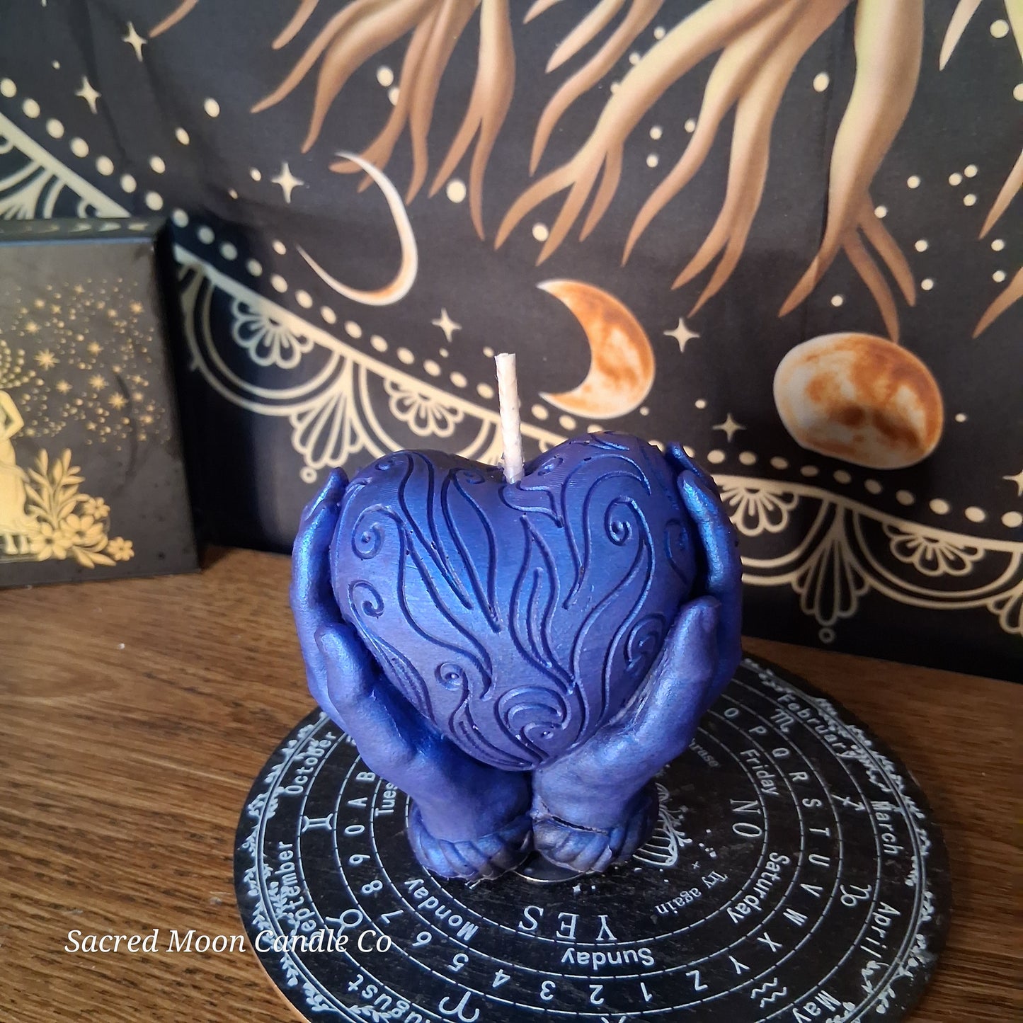 The Alchemist Embrace Saffron and Patchouli Scented Heart in Hands Candle