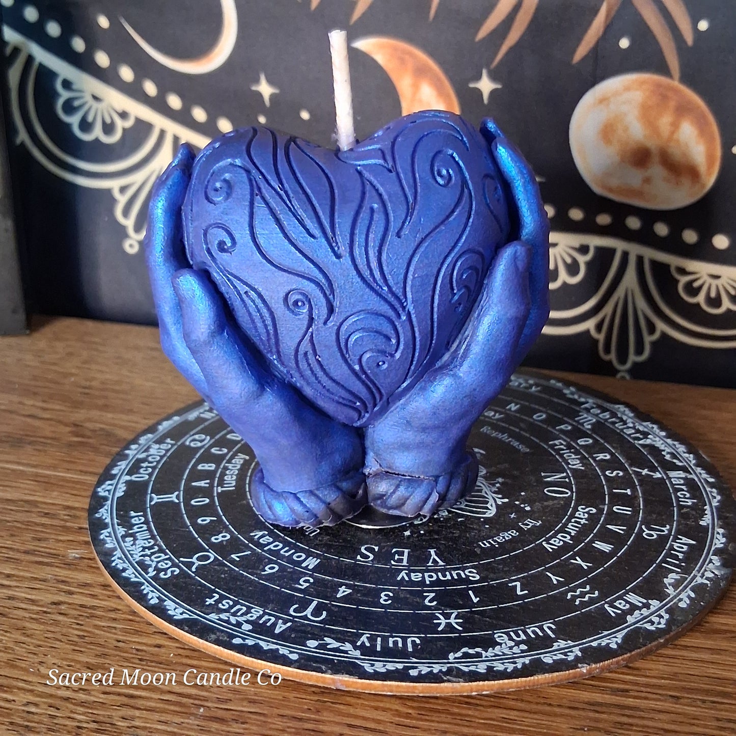 The Alchemist Embrace Saffron and Patchouli Scented Heart in Hands Candle