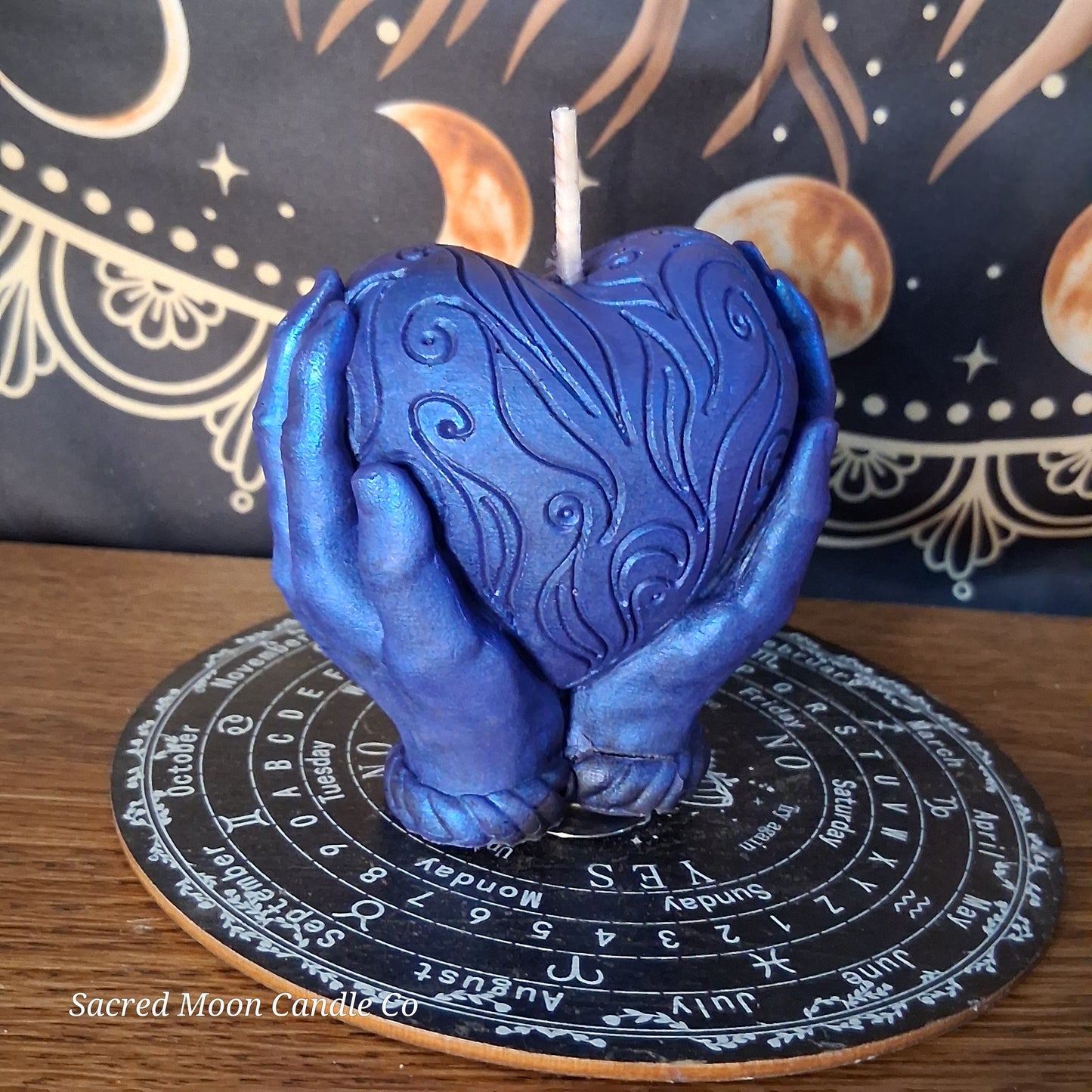 The Alchemist Embrace Saffron and Patchouli Scented Heart in Hands Candle