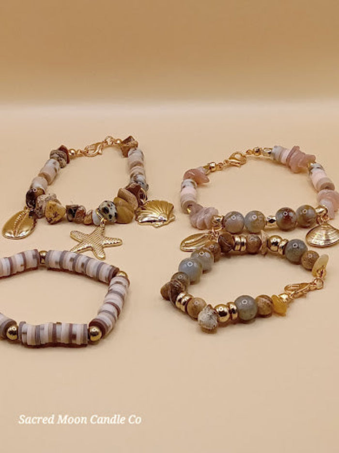 Bohemian natural stone bracelet stack by Sacred Moon Candle Co featuring mixed stones and gold charms
