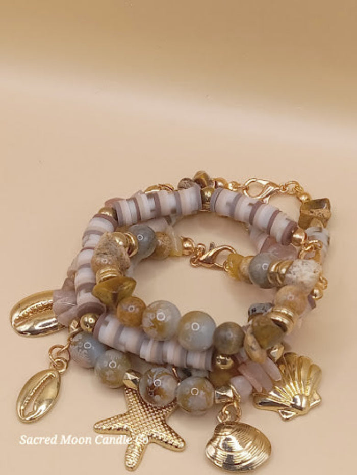 Bohemian natural stone bracelet stack with gold shell and starfish charms by Sacred Moon Candle Co