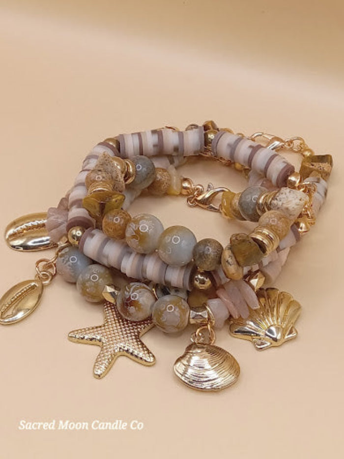 Bohemian natural stone bracelet stack with gold shell charms by Sacred Moon Candle Co