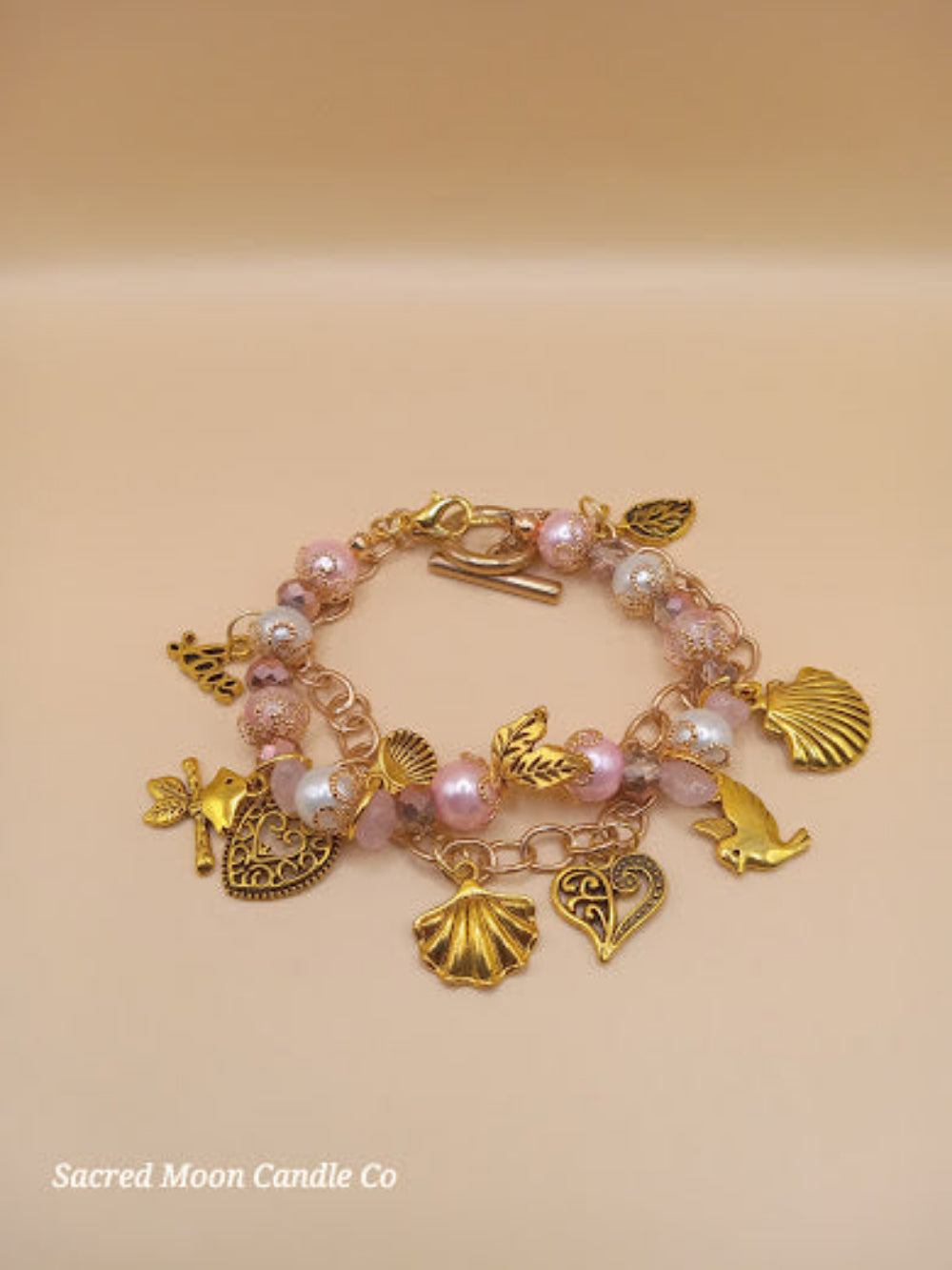 Sacred Moon Candle Co Aphrodite bracelet set with gold charms and pink pearl beads