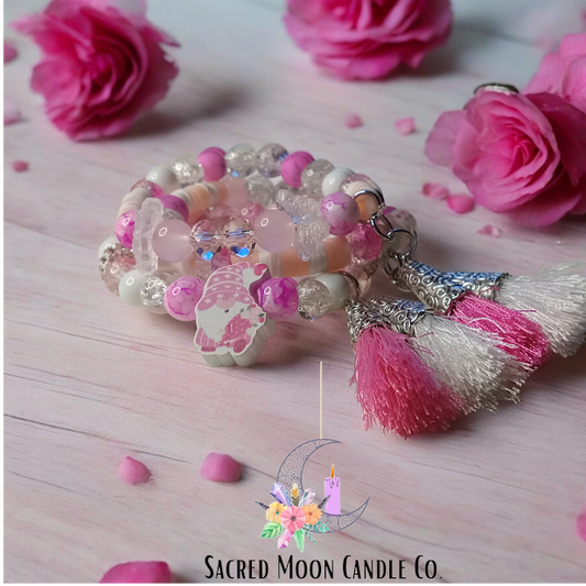 Cottagecore gnome Valentine bracelet stack with pink beads and tassels by Sacred Moon Candle Co