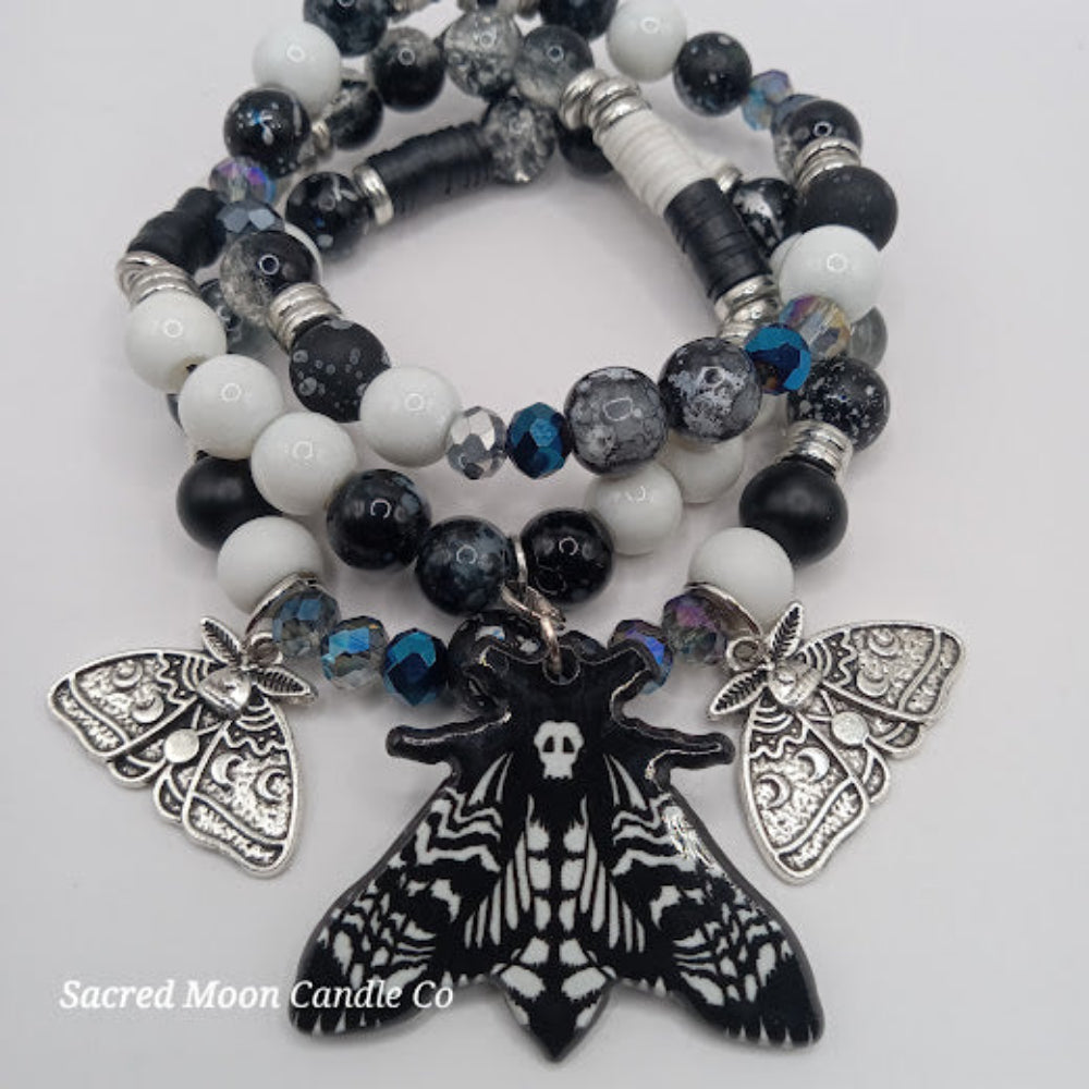 Sacred Moon Candle Co lunar moth jewelry set black and white beaded bracelet with moth charms