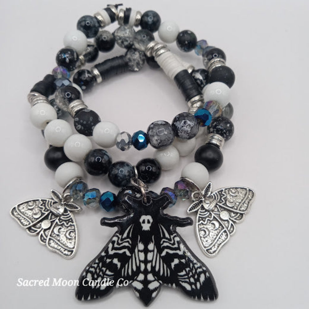 Lunar moth jewelry set bracelet by Sacred Moon Candle Co featuring black and white beads with silver moth charms