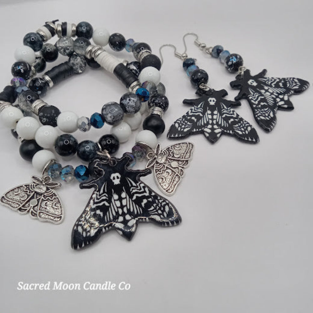Lunar moth jewelry set with black and white bead bracelets and matching moth earrings by Sacred Moon Candle Co