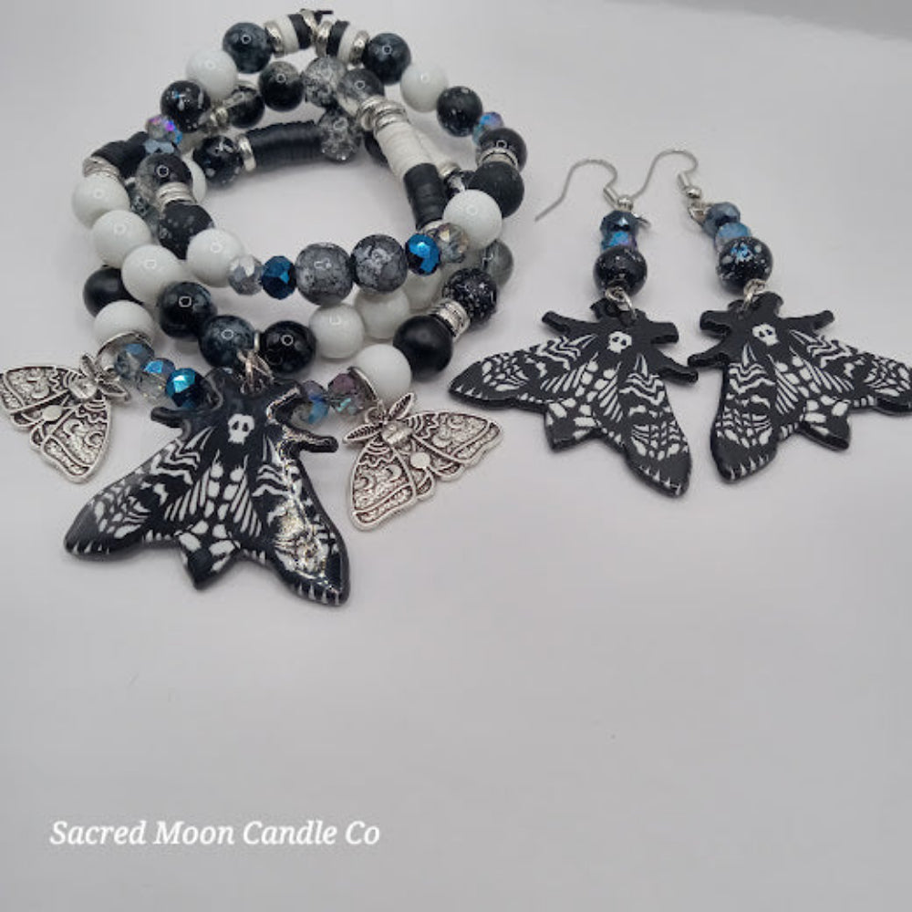 Lunar moth jewelry set with black and white beaded bracelets and matching moth earrings by Sacred Moon Candle Co