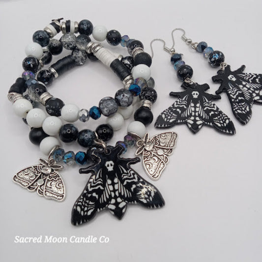 Sacred Moon Candle Co lunar moth jewelry set with black and white beaded bracelet and matching moth earrings