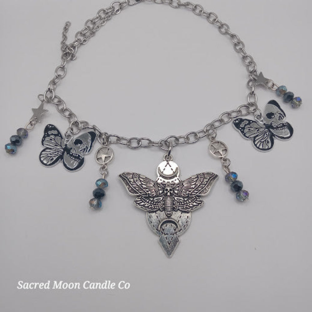 Sacred Moon Candle Co silver lunar moth jewelry set bracelet with detailed moth charms and blue bead accents