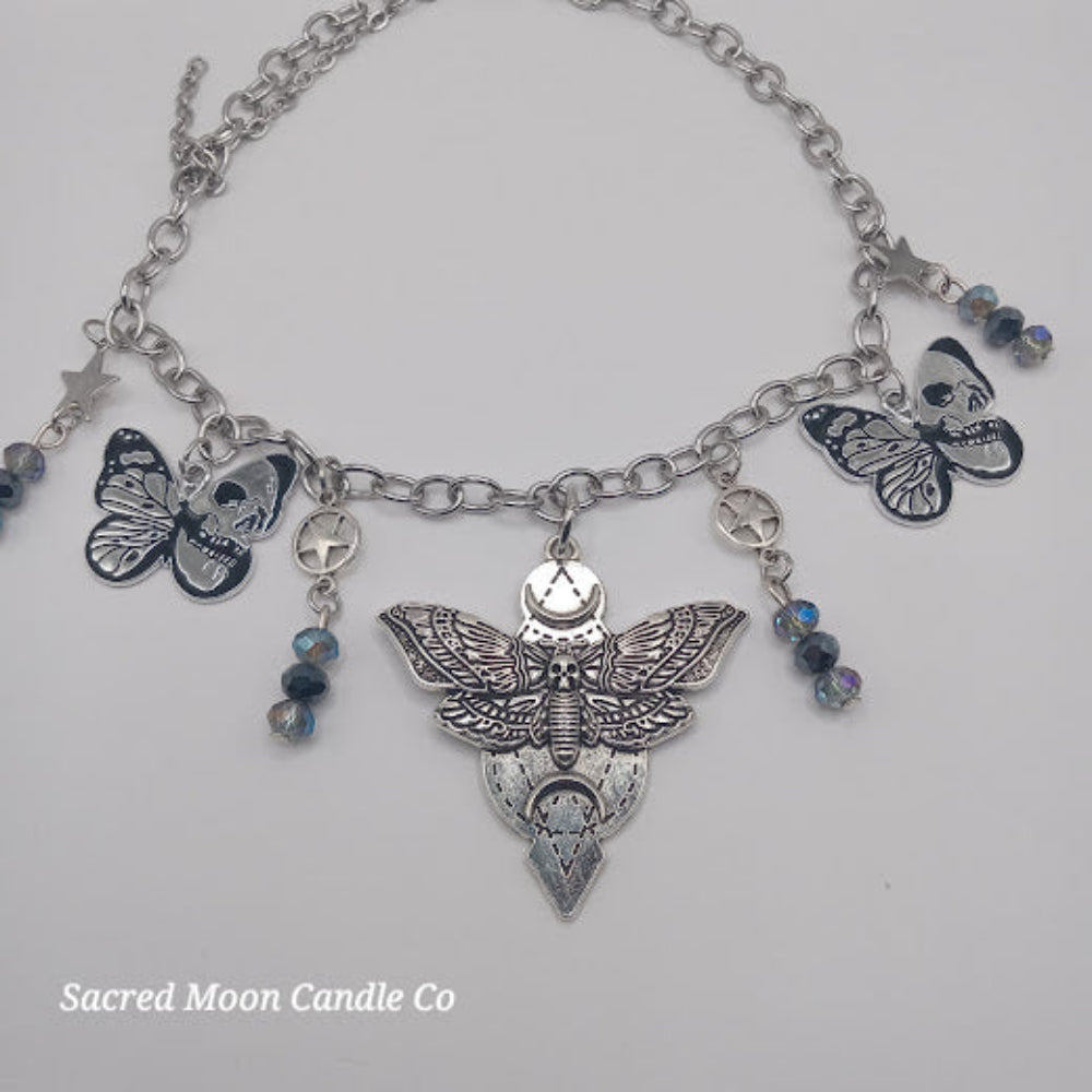 Silver lunar moth jewelry set bracelet by Sacred Moon Candle Co with detailed moth charms and blue beads