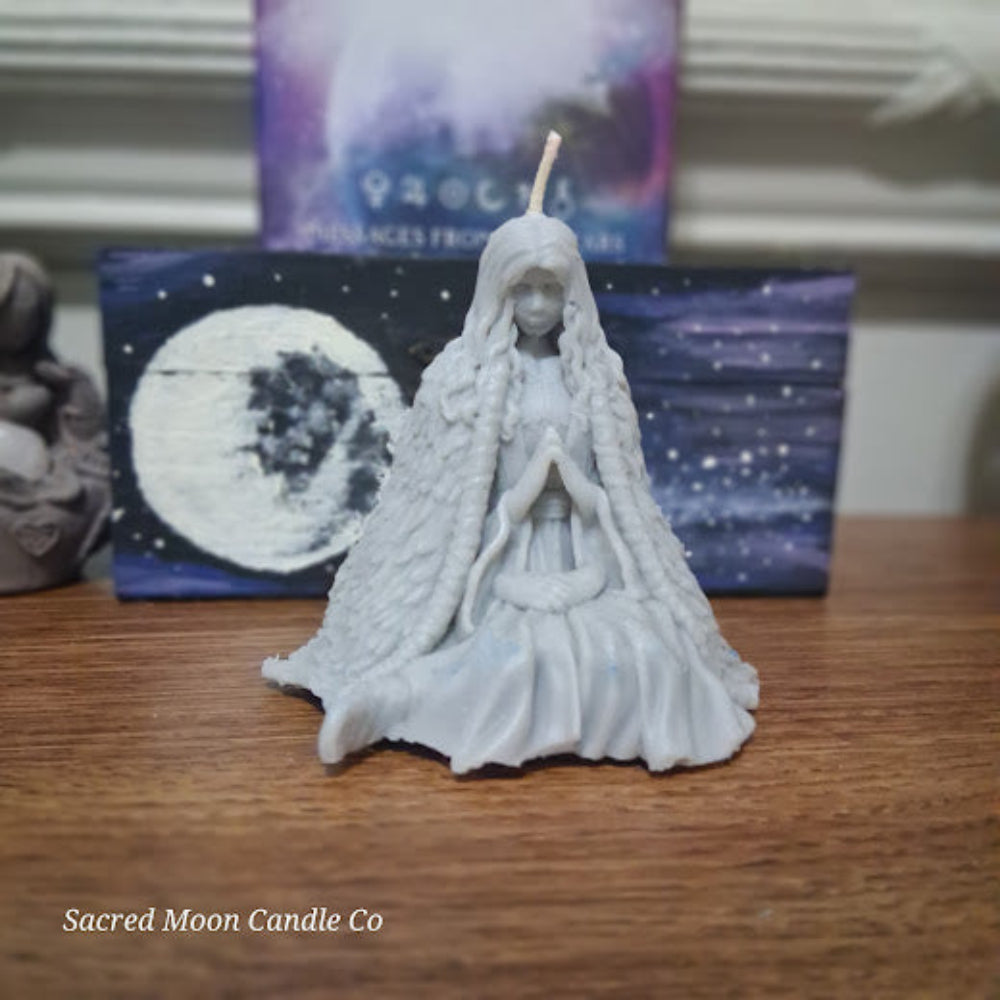 Sacred Moon Candle Co Mother Earth goddess candle sculpted seated goddess with braided hair and prayer pose