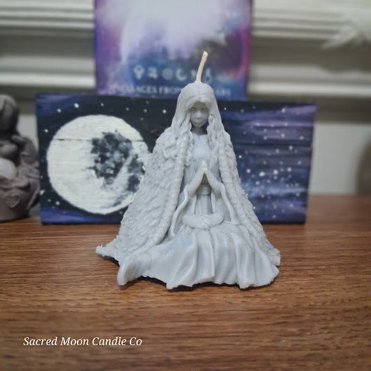 Mother Earth goddess candle by Sacred Moon Candle Co sculpted white seated goddess with braided hair praying