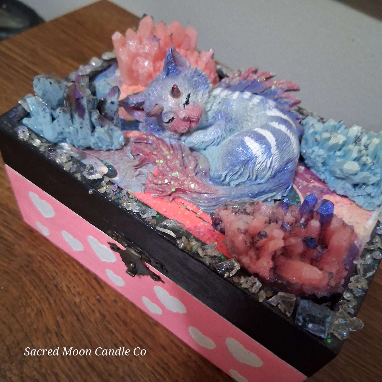 Sacred Moon Candle Co mystical cat dragon apothecary box featuring a sleeping cat dragon with pastel crystals