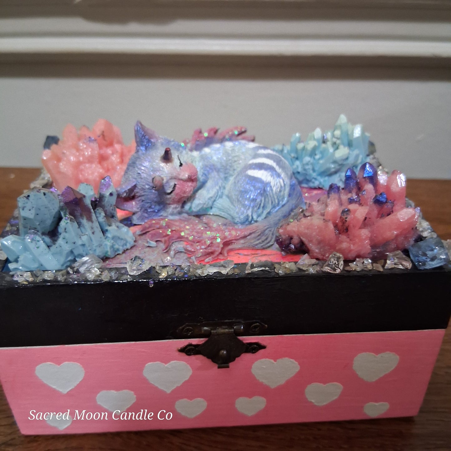 Sacred Moon Candle Co mystical cat dragon apothecary box pink heart box topped with sleeping pastel cat dragon and crystals