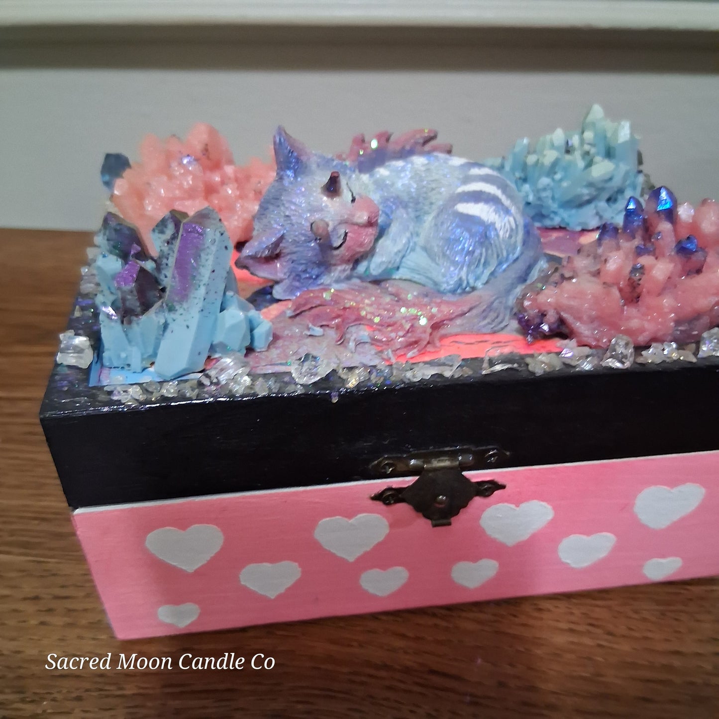 mystical cat dragon apothecary box by Sacred Moon Candle Co with sleeping cat dragon sculpture pastel crystals and hearts