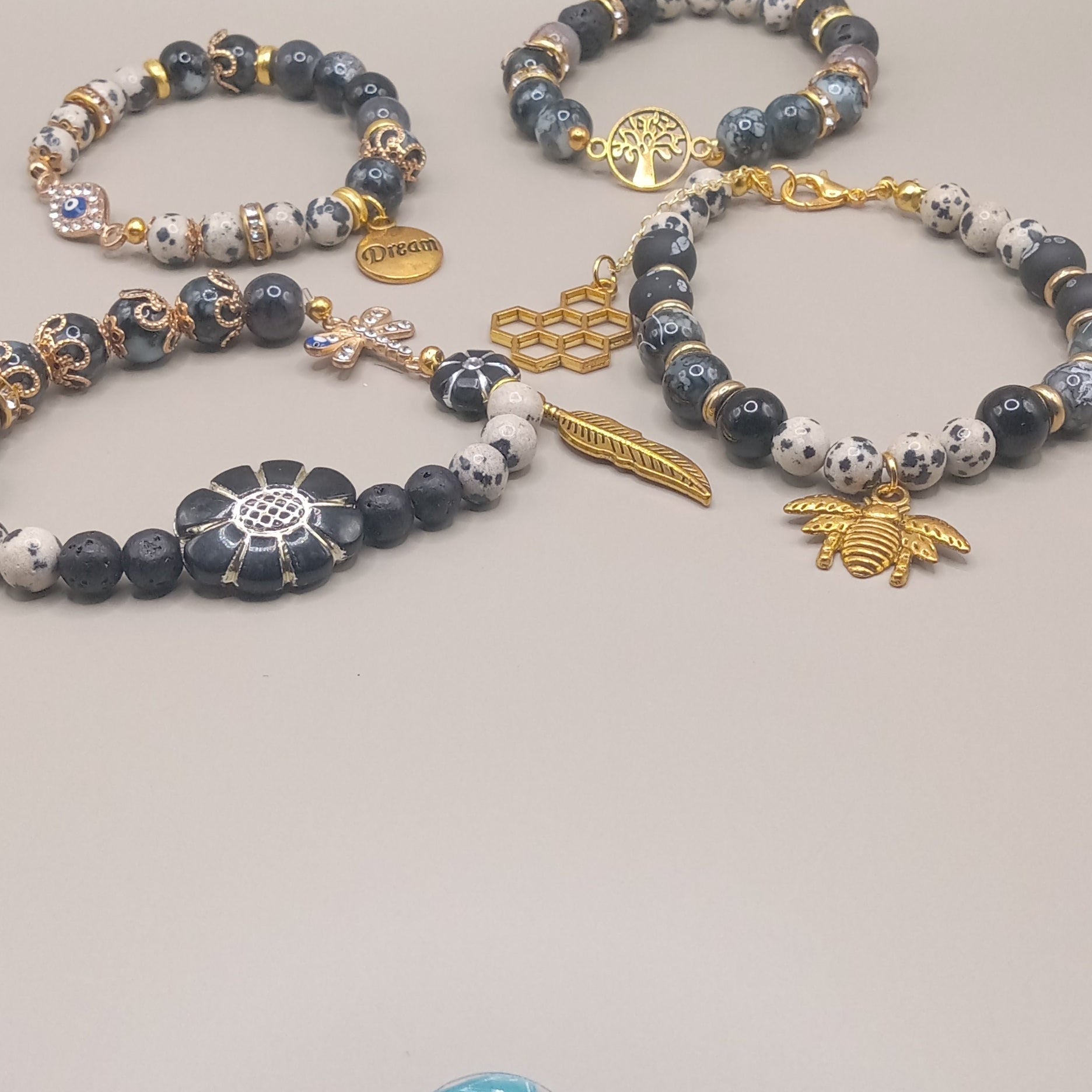 One with Nature Bohemian Dalmatian Jasper Bracelet Stack with gold bee feather tree and sunflower charms