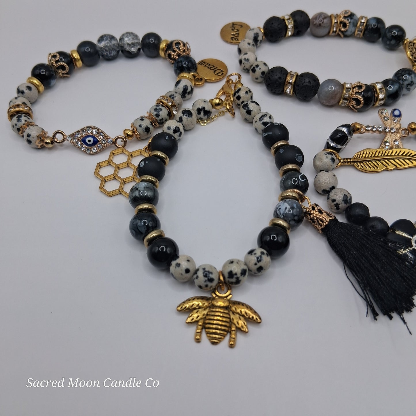 One with Nature Bohemian Dalmatian Jasper Bracelet Stack featuring spotted jasper and black beads with gold bee charm