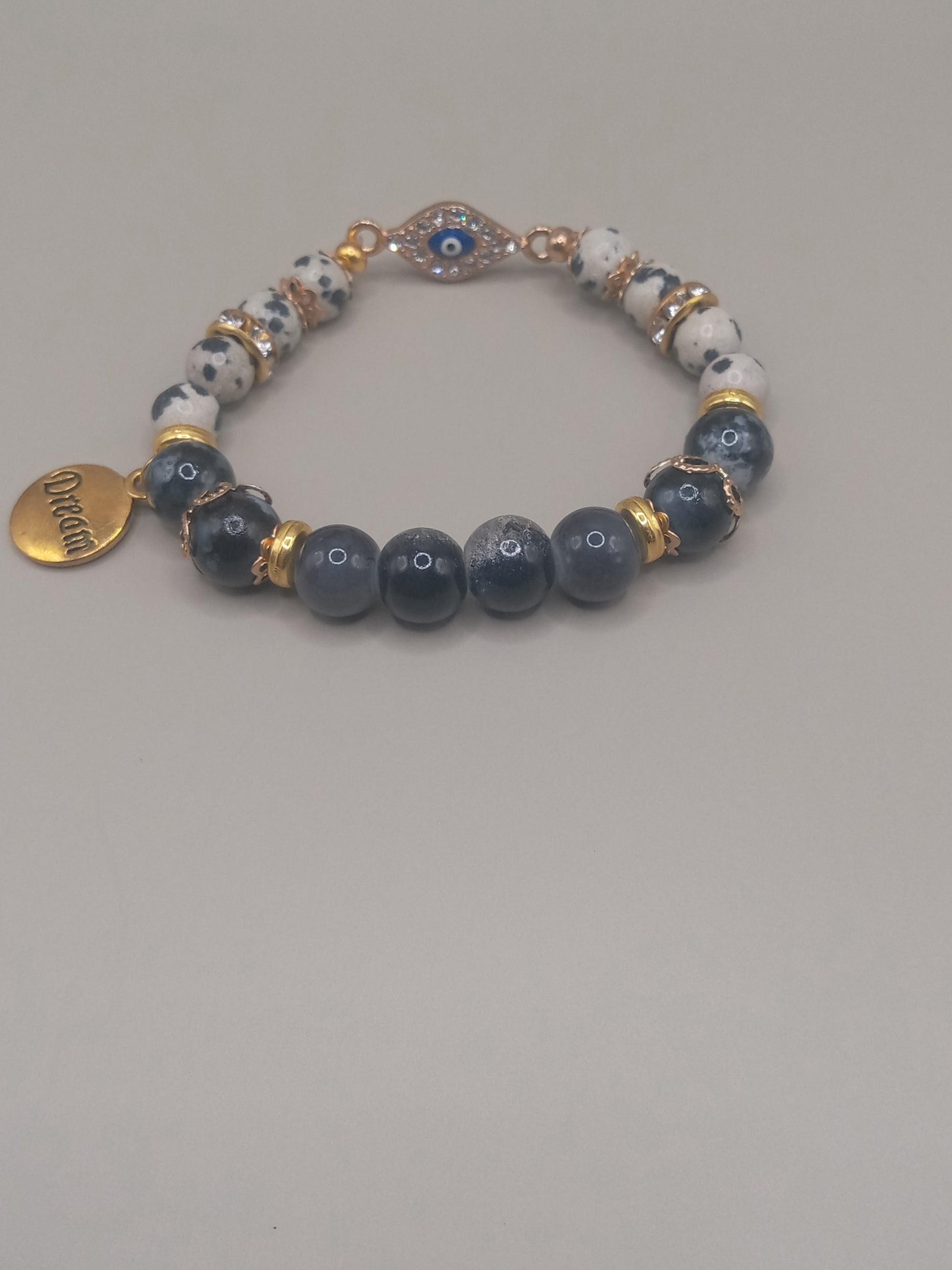One with Nature Bohemian Dalmatian Jasper Bracelet Stack white spotted jasper and gray beads with gold spacers and evil eye charm
