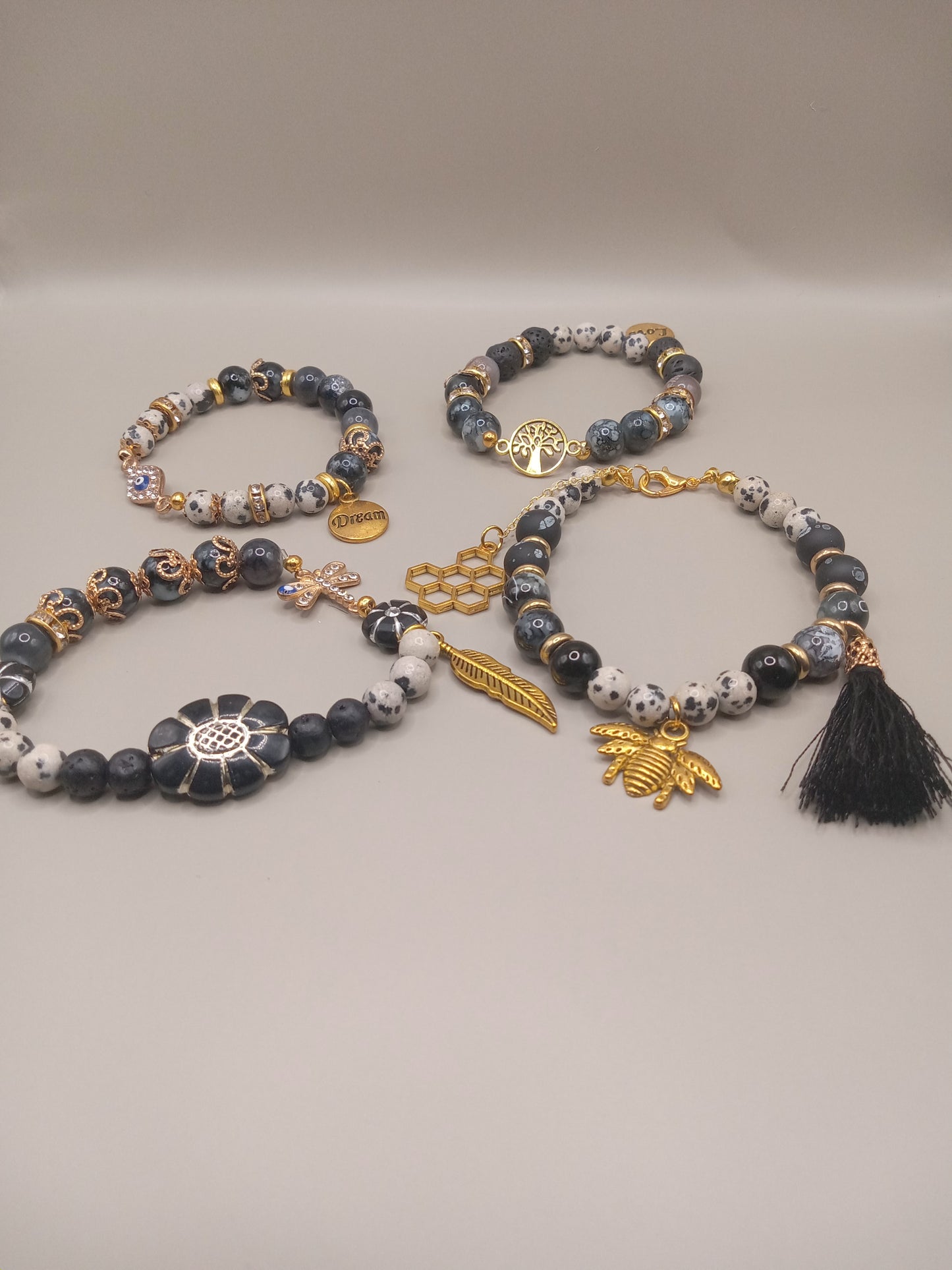 One with Nature Bohemian Dalmatian Jasper Bracelet Stack four bohemian bracelets with gold charms tassel