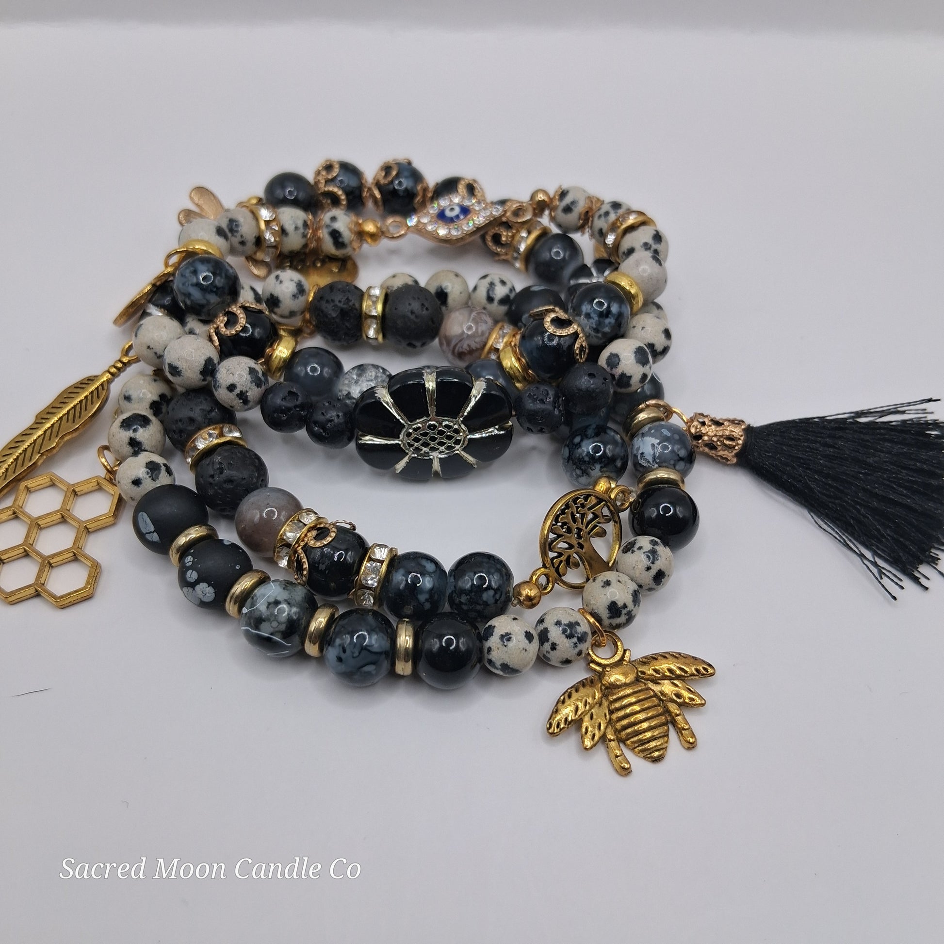One with Nature Bohemian Dalmatian Jasper Bracelet Stack by Sacred Moon Candle Co with black white jasper beads gold charms tassel