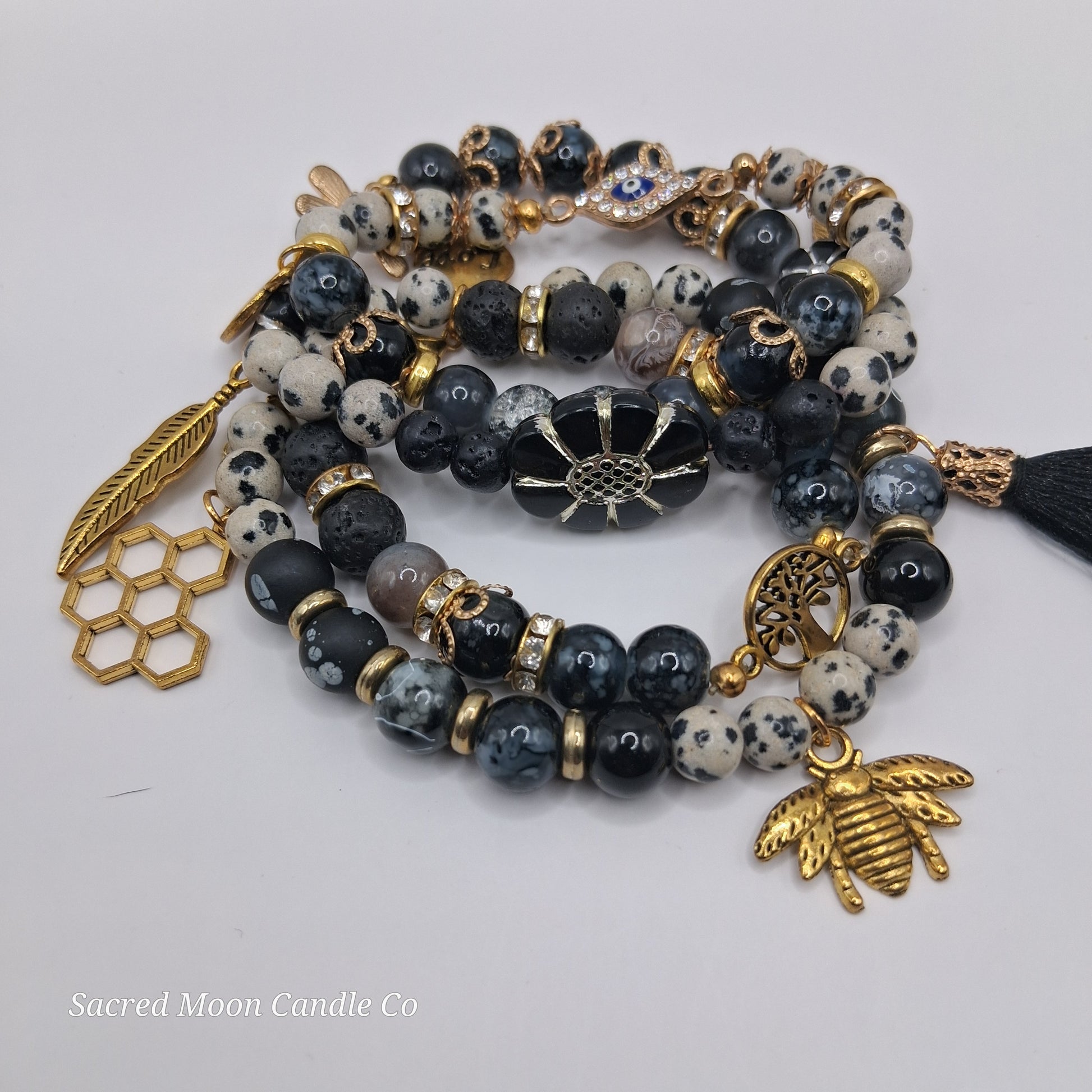 One with Nature Bohemian Dalmatian Jasper Bracelet Stack with gold bee feather honeycomb and tassel charms