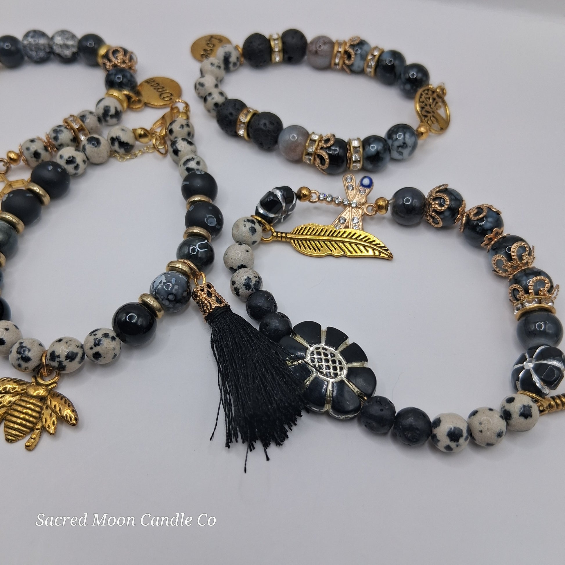 One with Nature Bohemian Dalmatian Jasper Bracelet Stack with black tassel gold feather and flower charms