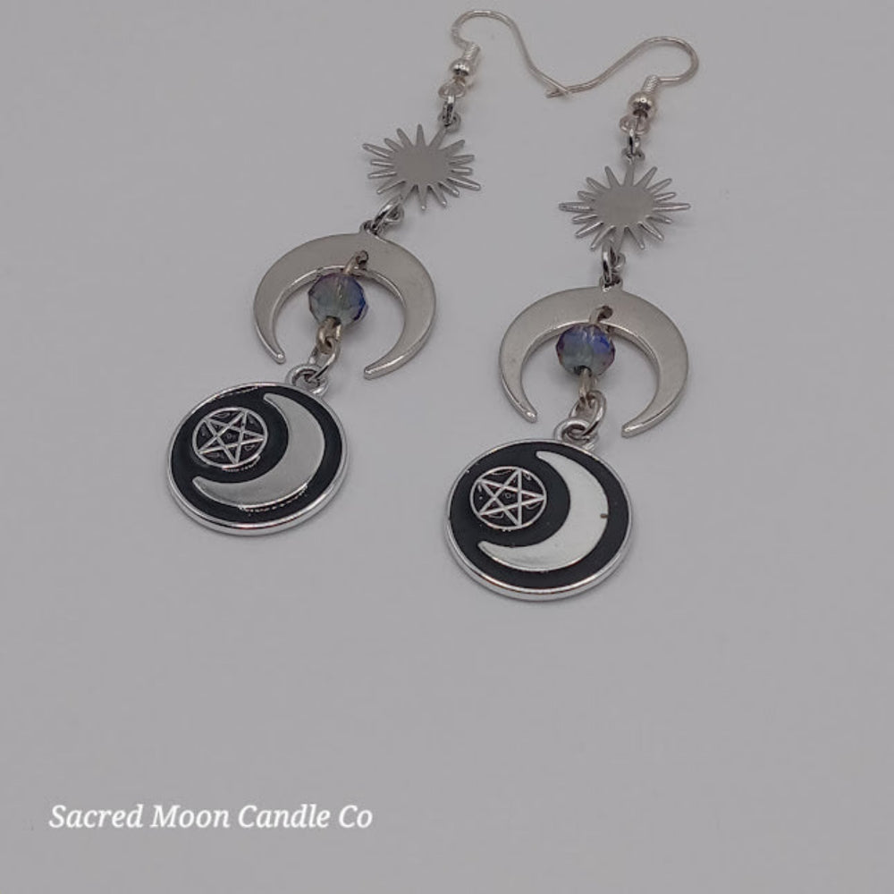 Sacred Moon Candle Co silver pentacle moon dangle earrings with sun and crescent moon design