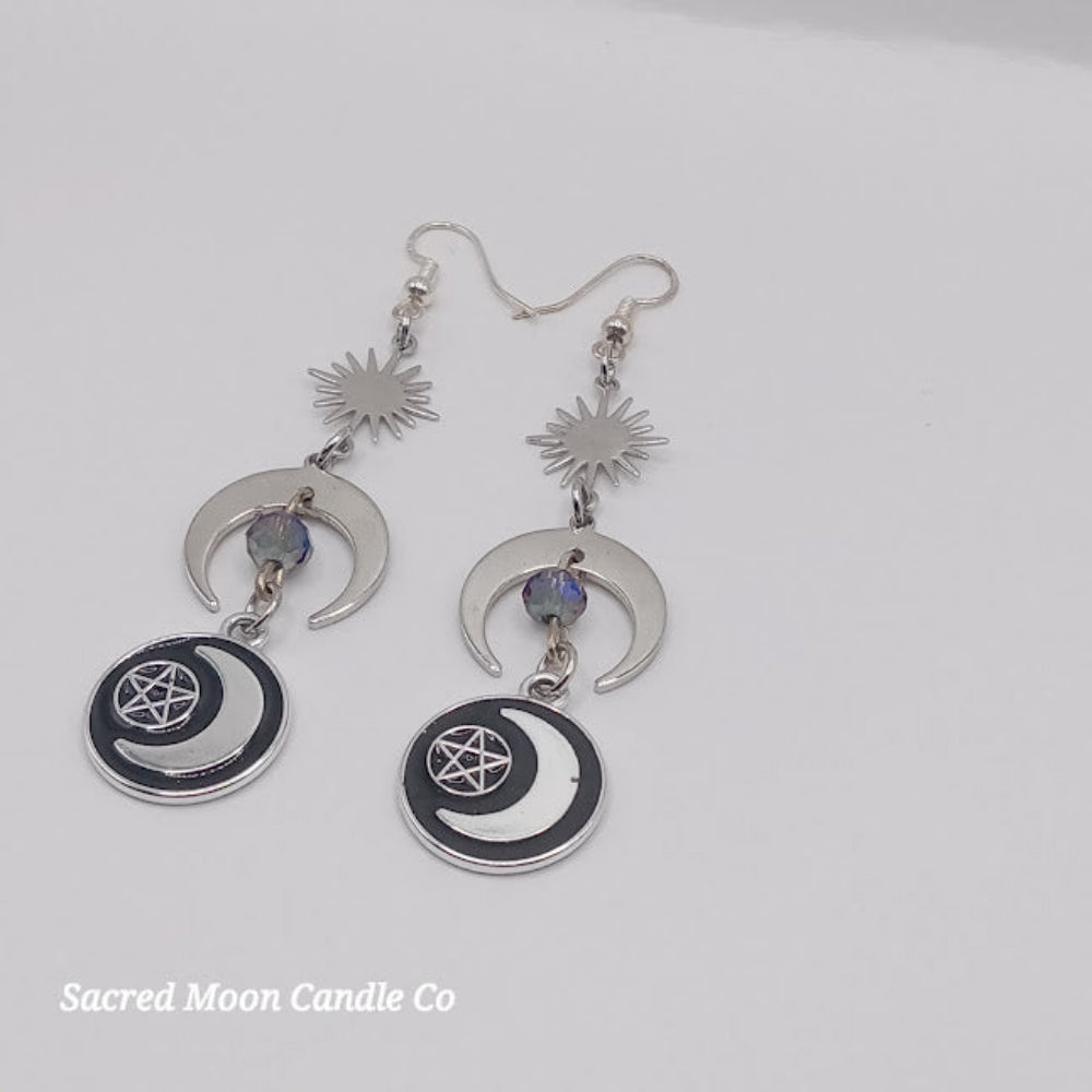 Sacred Moon Candle Co pentacle moon dangle earrings with crescent moons and sun charms in silver
