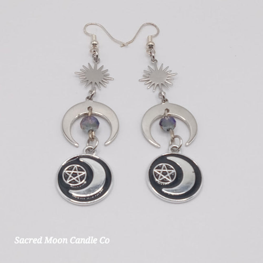 Sacred Moon Candle Co silver pentacle moon dangle earrings with crescent moons and sun charms