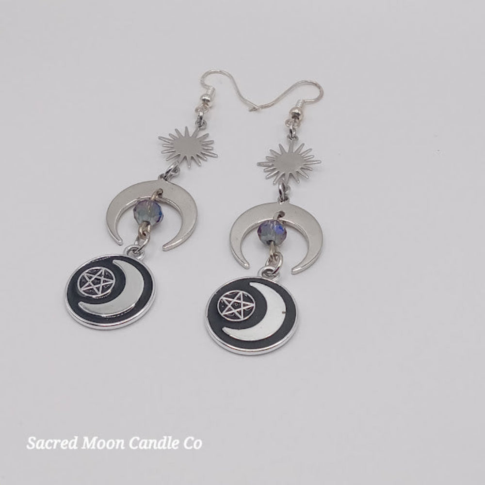 Sacred Moon Candle Co silver pentacle moon dangle earrings with crescent moon and sun charm design