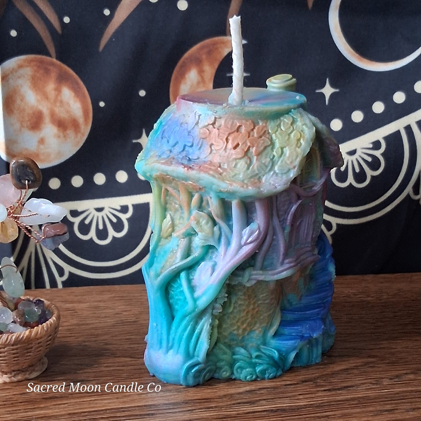Rainbow Sherbert Sweet Blossom Scented Treehouse Candle by Sacred Moon Candle Co shaped like a colorful treehouse